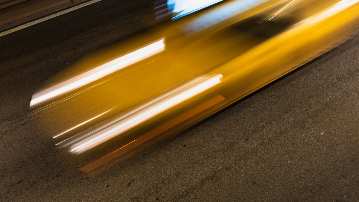 A vehicle in motion, shot with motion blur